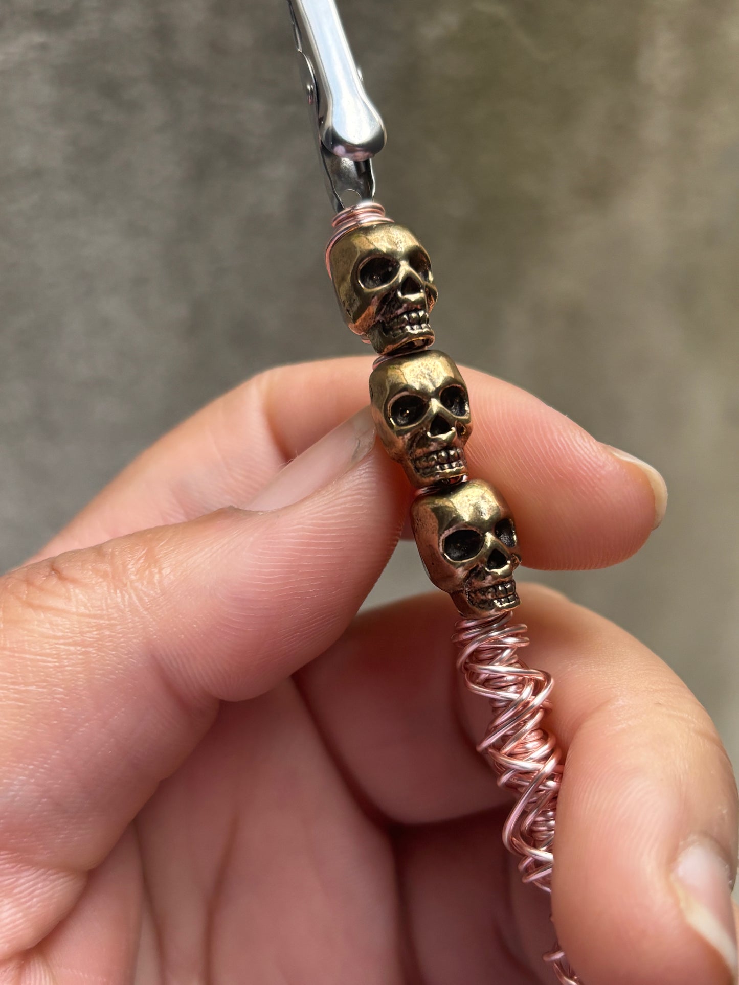 Rose gold skull roach clip