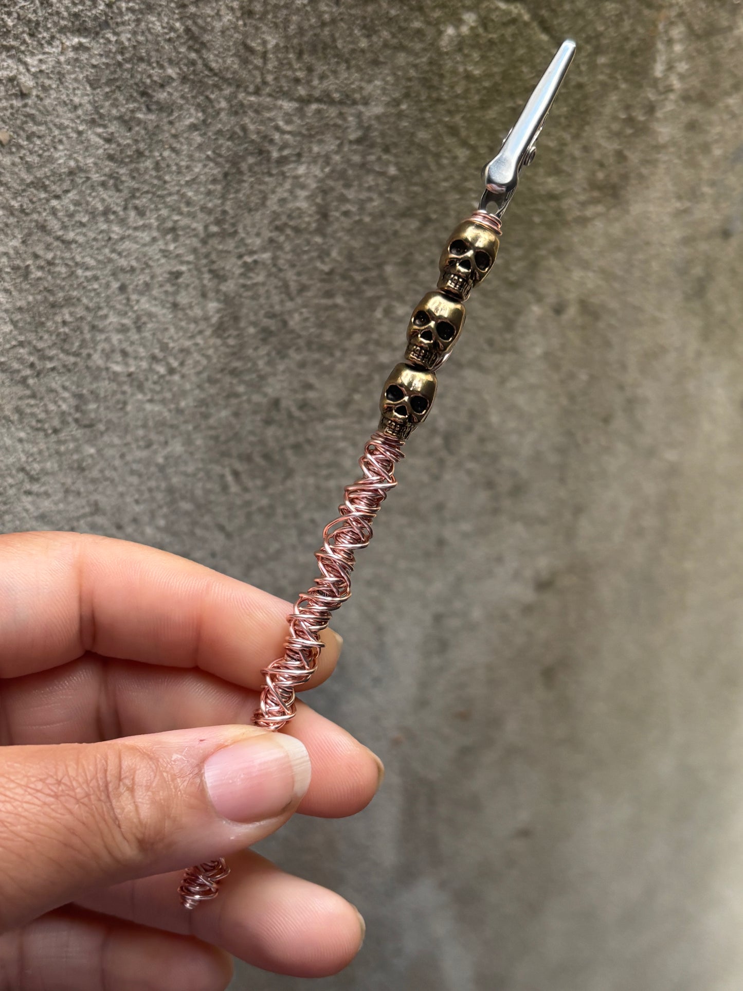 Rose gold skull roach clip