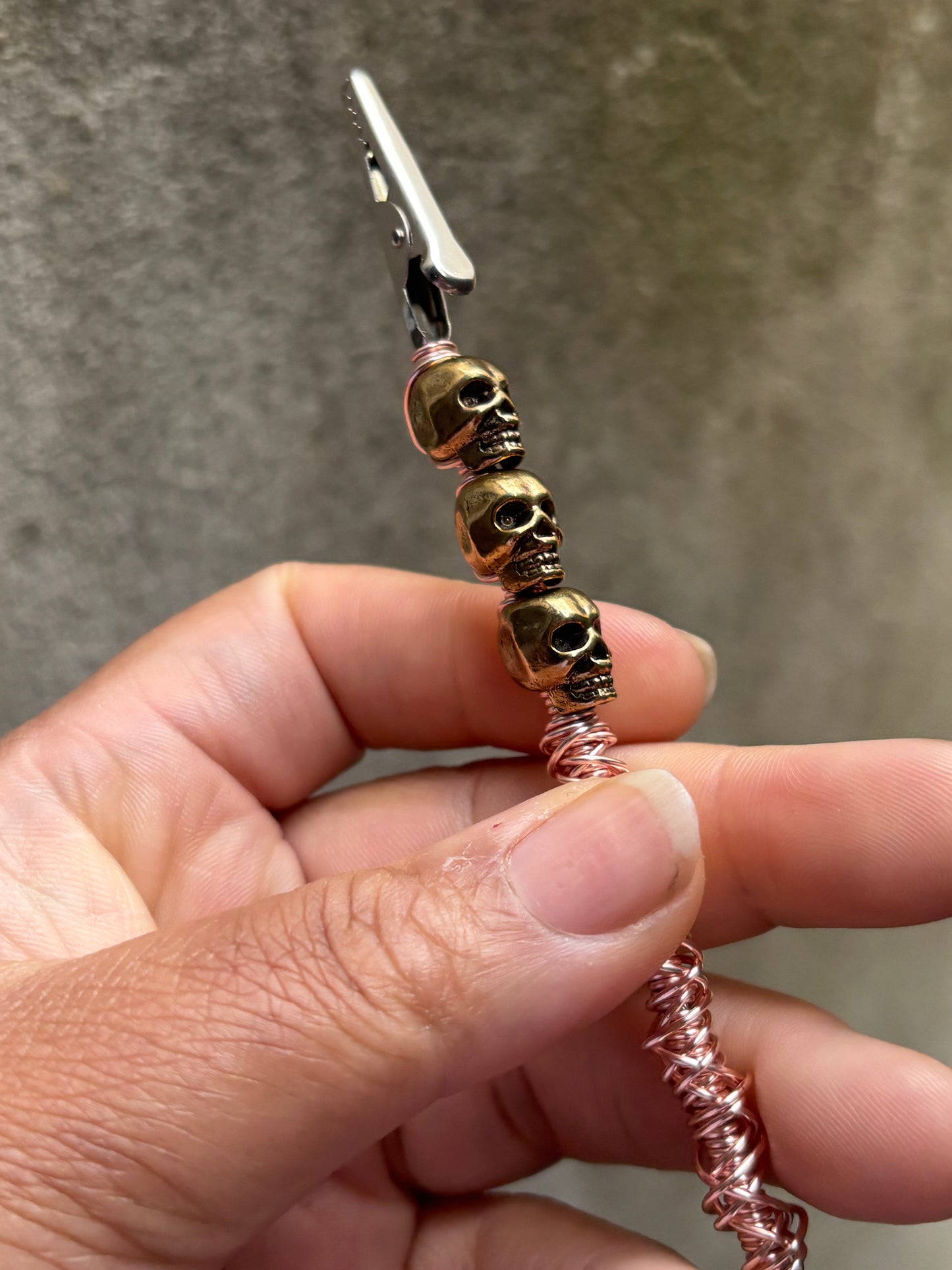 Rose gold skull roach clip